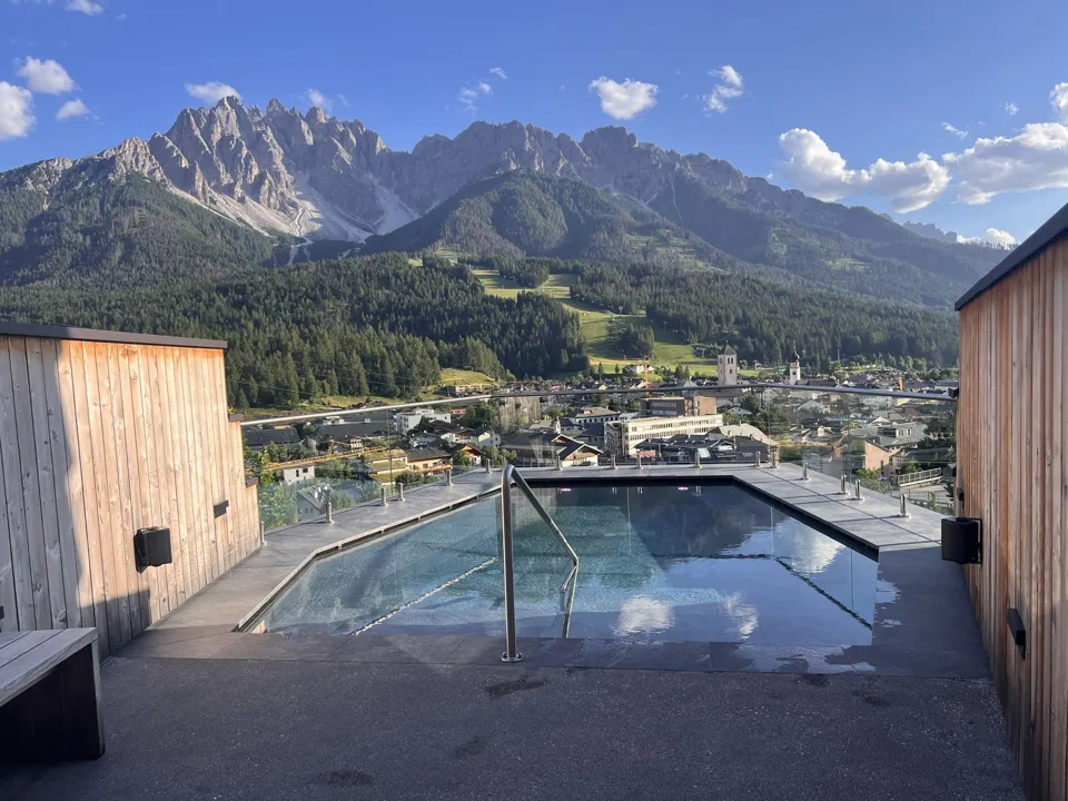 Naturhotel Leitlhof pool overlooking San Candido and the Dolomites